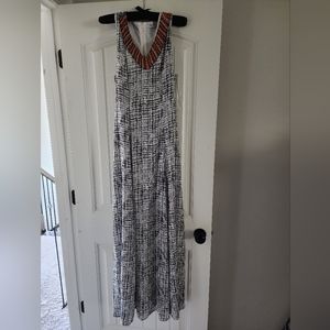 Xtaren maxi dress with beading detail. Dress is black/white
